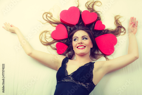 Attractive woman with hearts in hair.