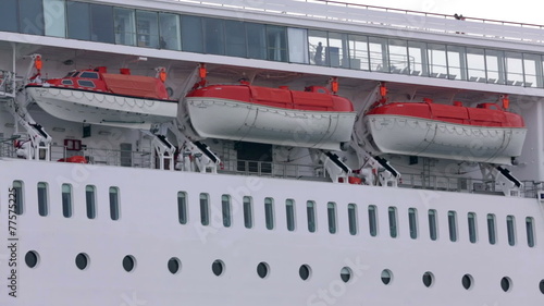 Pan shot of safety boats on cruiser's middledeck photo