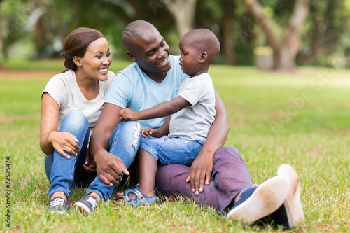 young african family sitting outdoors