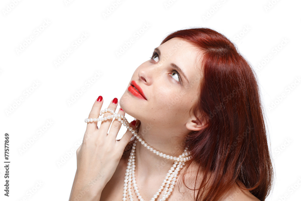 Portrait of beautiful red- haired woman.