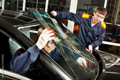 Two Real Mechanics working in Auto Repair Shop © AlexanderNovikov