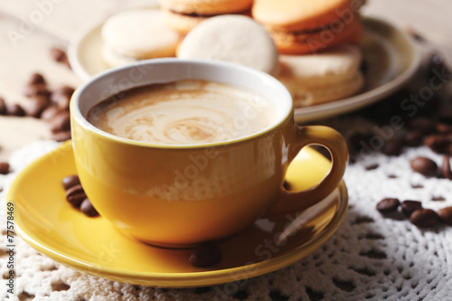 Gentle colorful macaroons and  coffee in mug