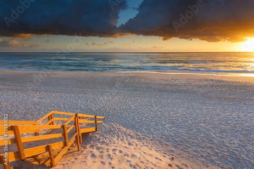 Australian beach entry with stairs in foreground at sunrise