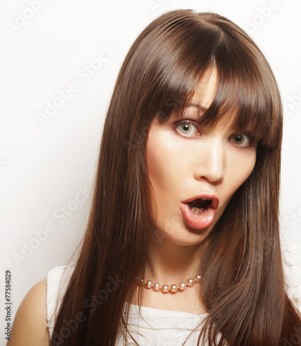 Beautiful young surprised woman.