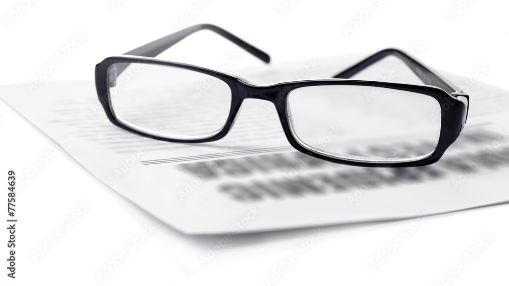 Glasses and newspapers, close-up Glasses and newspapers, close-up