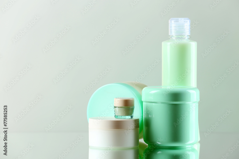 Cosmetic bottles on light background Cosmetic bottles on light background