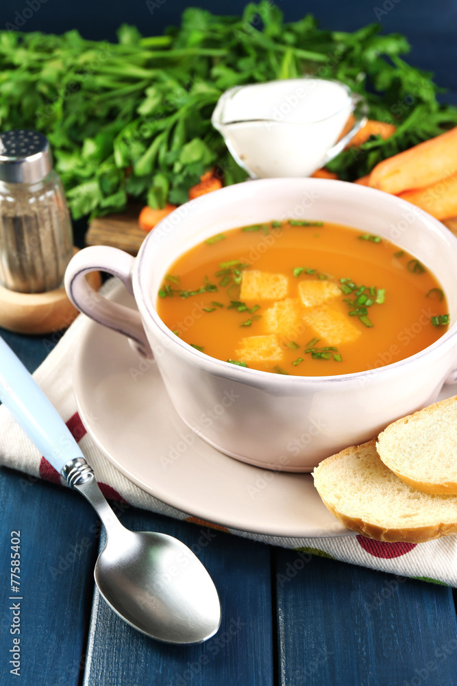 Composition with carrot soup, ingredients and herbs Composition with carrot soup, ingredients and herbs