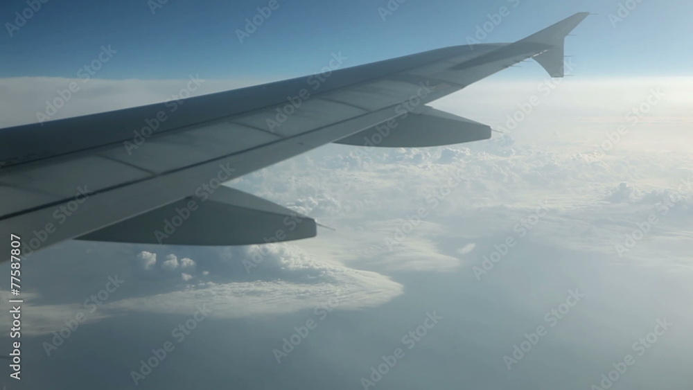 Beautiful cloudscape view from airplane with wing in front Beautiful cloudscape view from airplane with wing in front