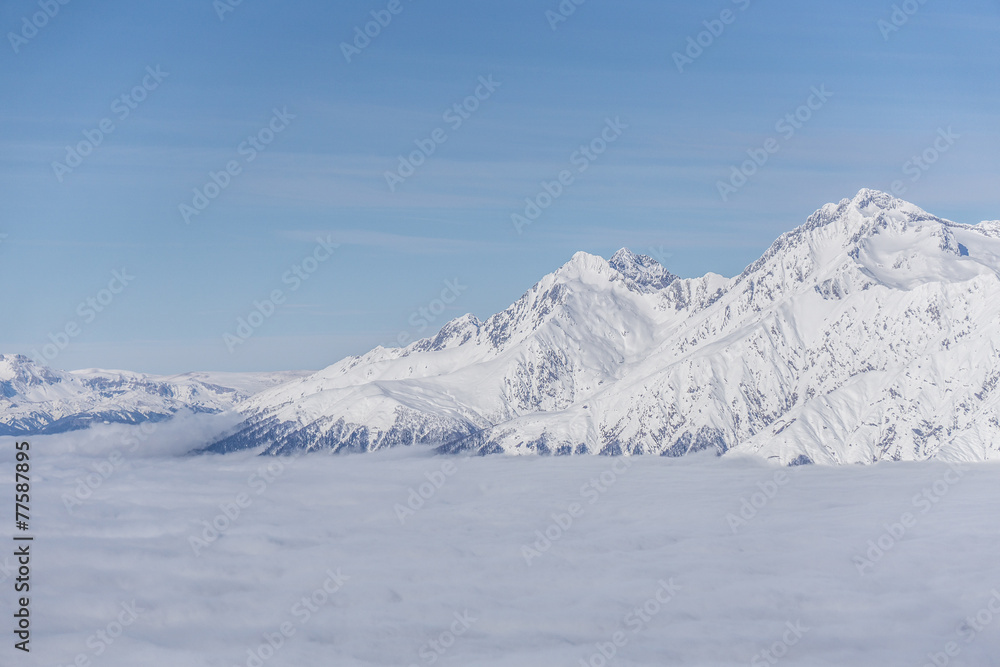 Fototapeta premium View on mountains and blue sky above clouds