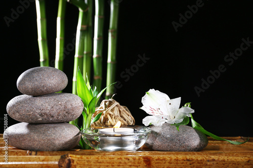 Beautiful composition with spa stones and candle