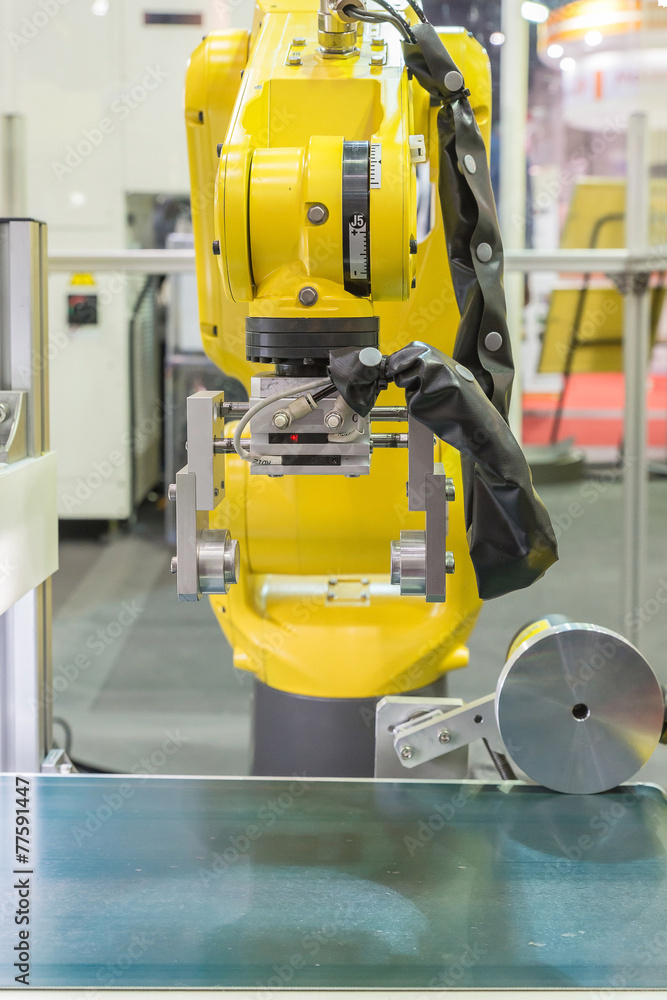 Automatic robot arm with optical sensor working in factory Automatic robot arm with optical sensor working in factory