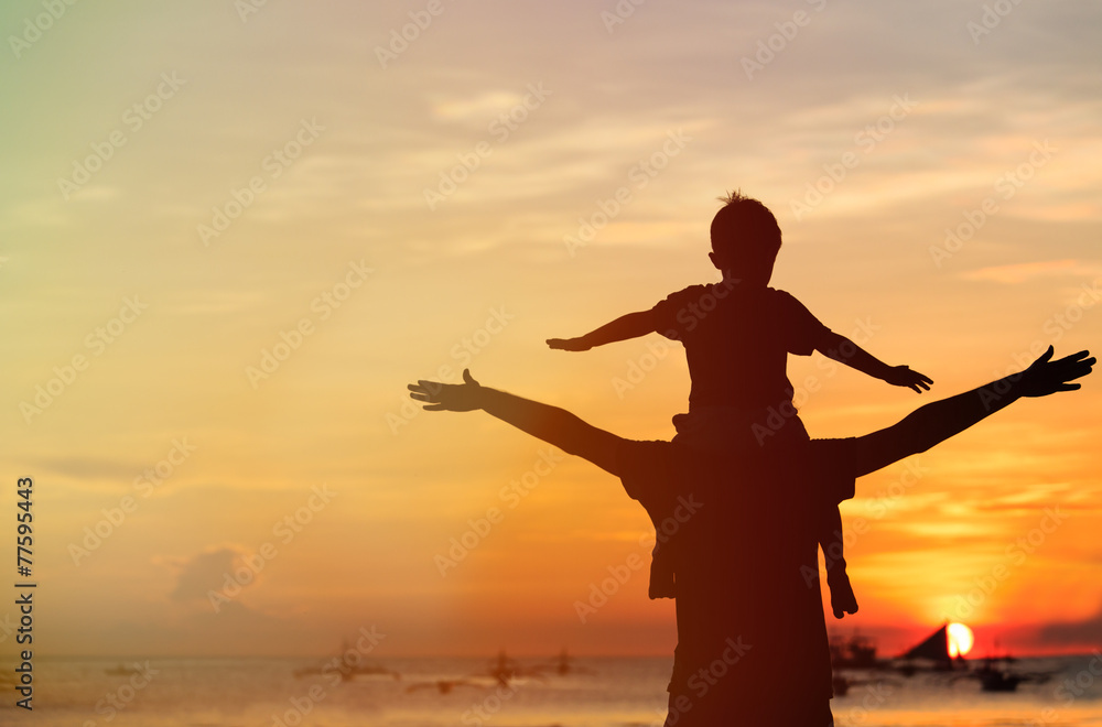 father and son having fun on sunset