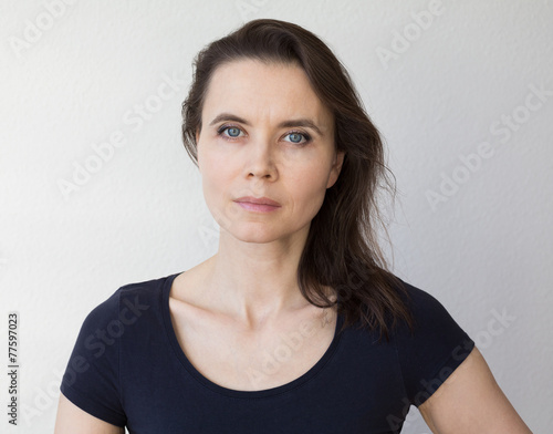 Serious woman looking into camera