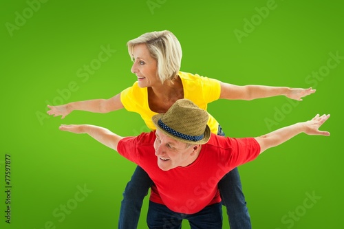 Composite image of mature couple joking about together