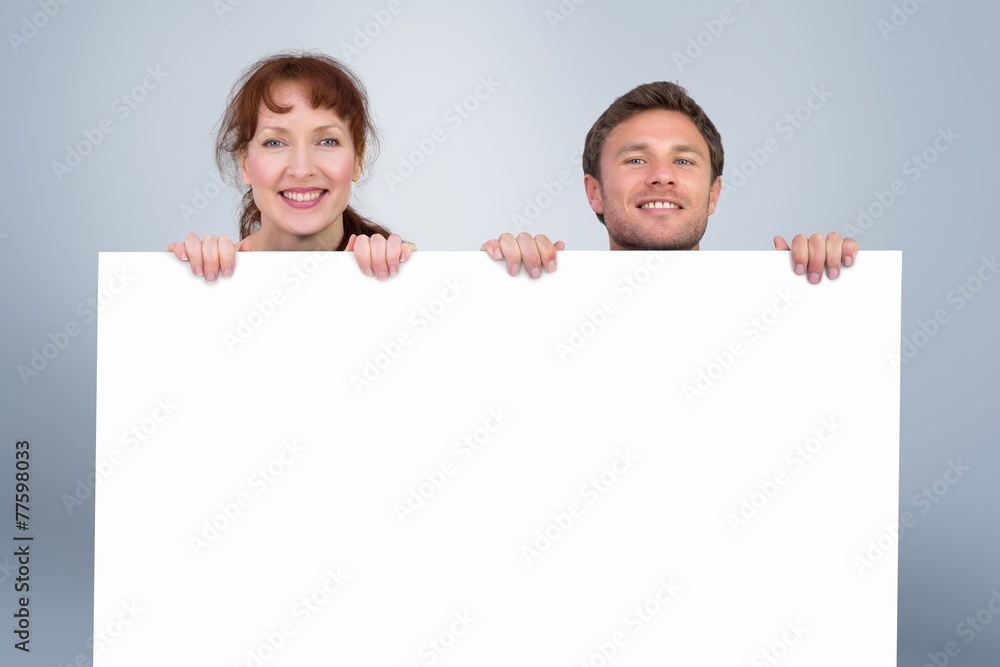 Composite image of couple looking at the camera Composite image of couple looking at the camera