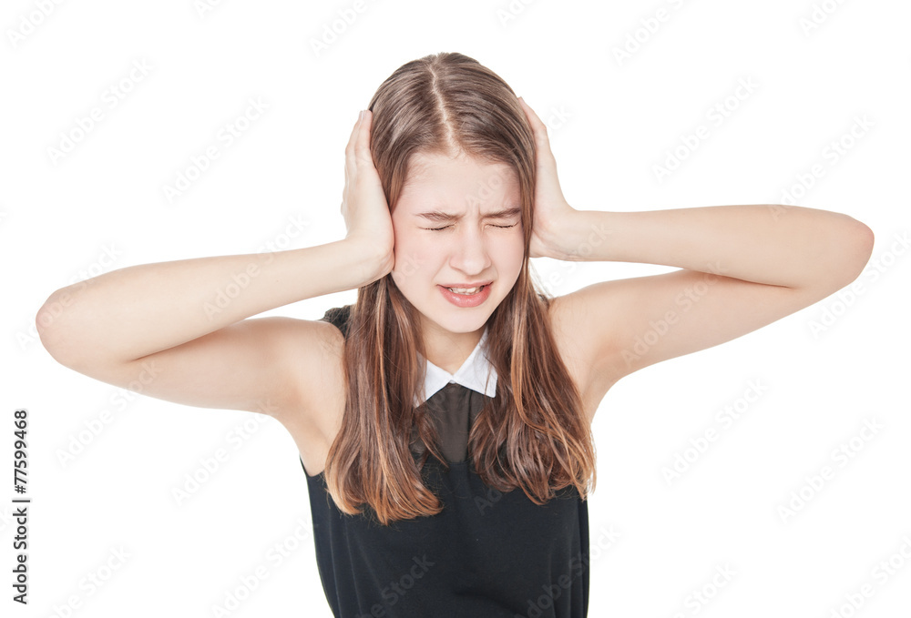 Young teenager girl covering ears with her hands isolated Young teenager girl covering ears with her hands isolated