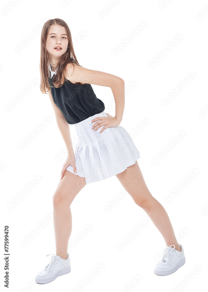 Fototapeta premium Young fashion girl in white skirt posing isolated