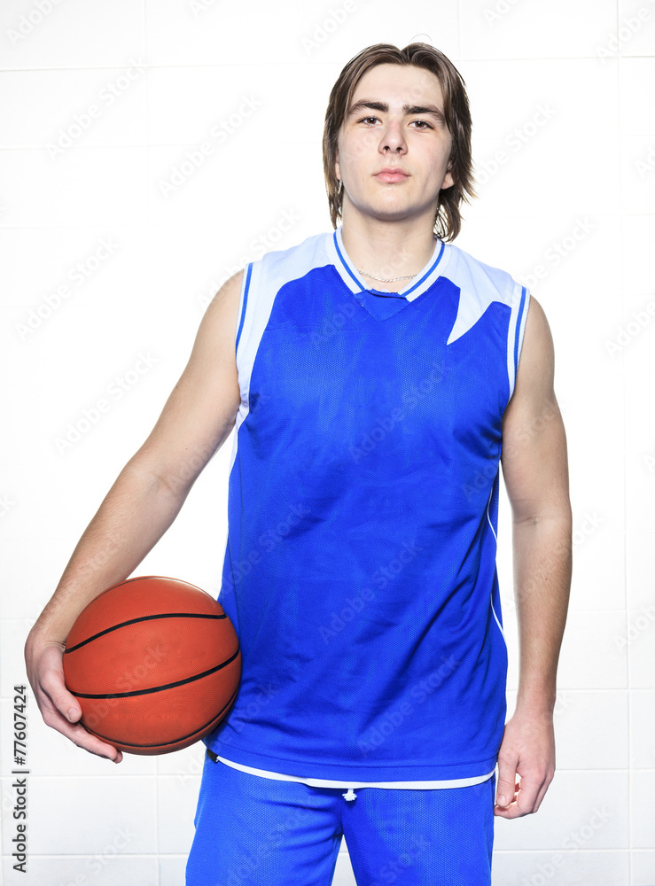 A teenager basketball player over a white background A teenager basketball player over a white background