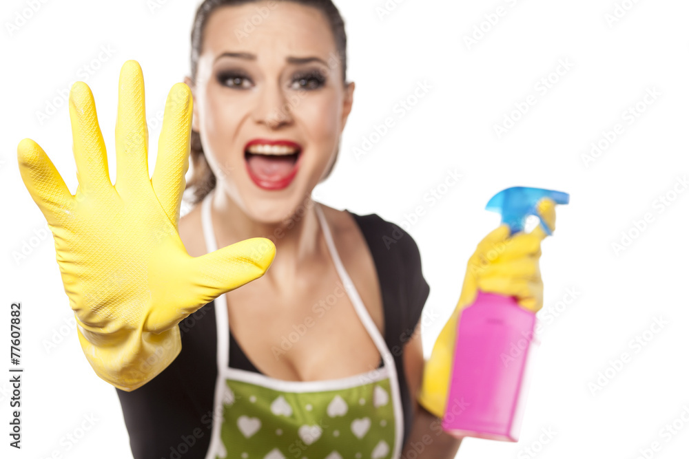 nervous housewife with rubber gloves showing stop gesture nervous housewife with rubber gloves showing stop gesture