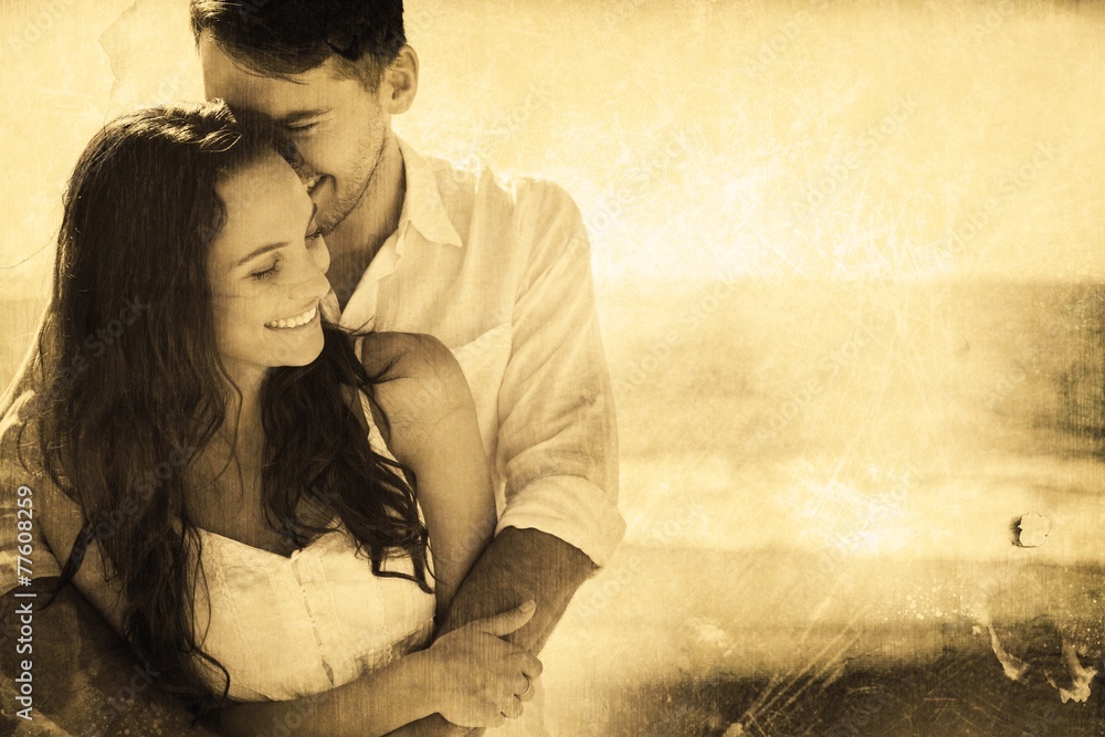 Composite image of attractive couple cuddling Composite image of attractive couple cuddling
