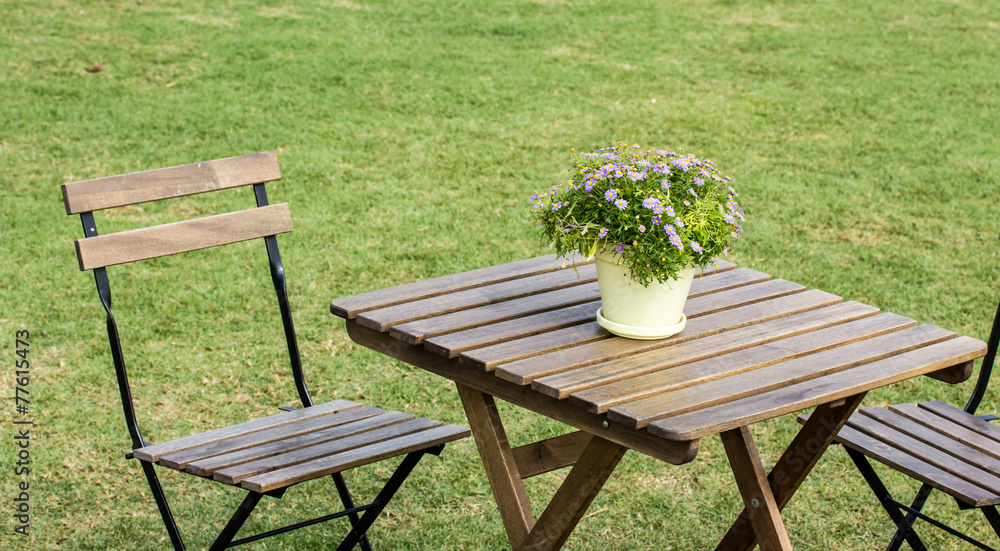 Fototapeta premium small beautiful flowers pots decoration on wooden table