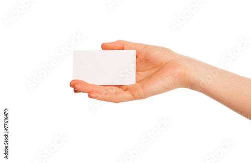 one hand holding a white piece of cardboard.