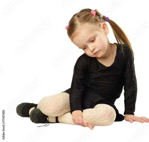 Obraz na płótnie Little Girl dancer sits on White Background w salonie