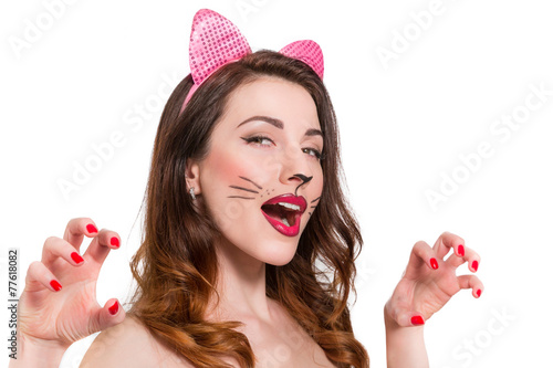 Cat-woman make-up on beautiful young girl. lipstick, nailpolish