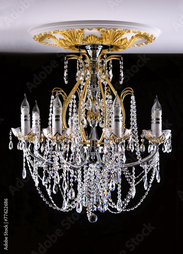 Classical style chandelier on ceiling