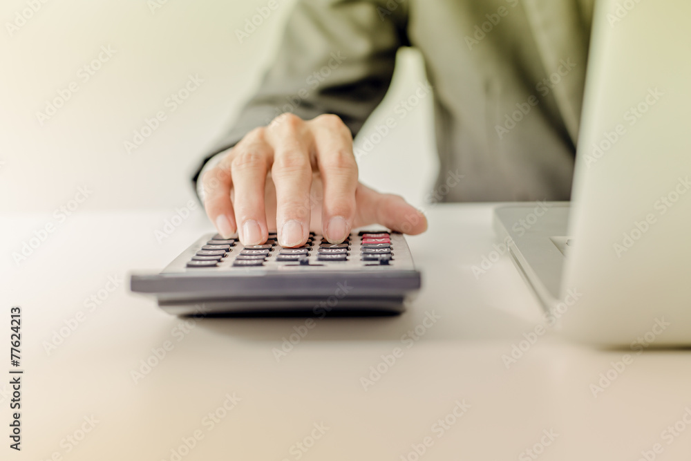 Closeup of businessman hands typing on laptop computer Closeup of businessman hands typing on laptop computer