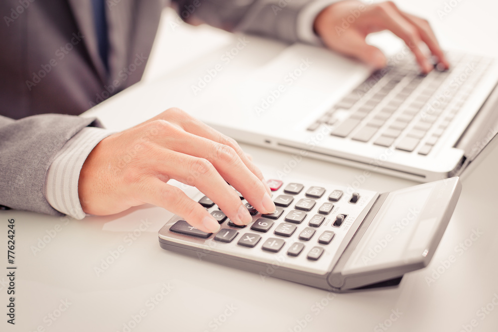 Closeup of businessman hands typing on laptop computer Closeup of businessman hands typing on laptop computer