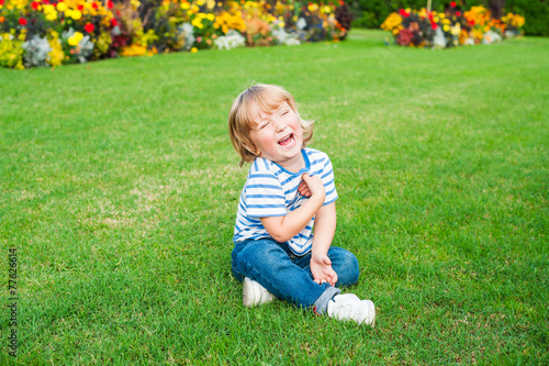Cute little boy playing outdoors