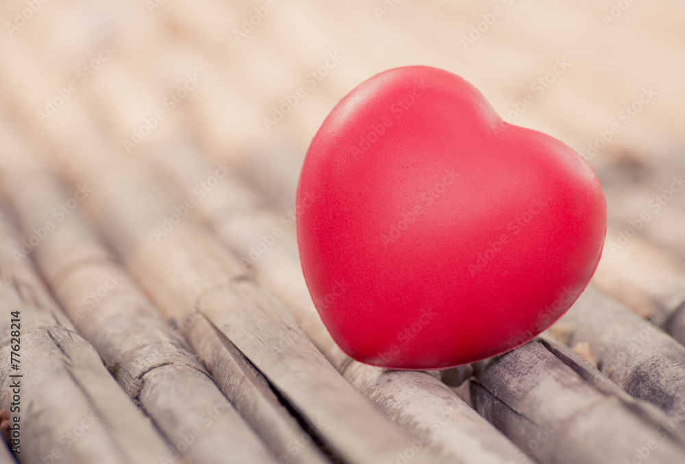 Fototapeta premium Red heart in Valentines with wood background.