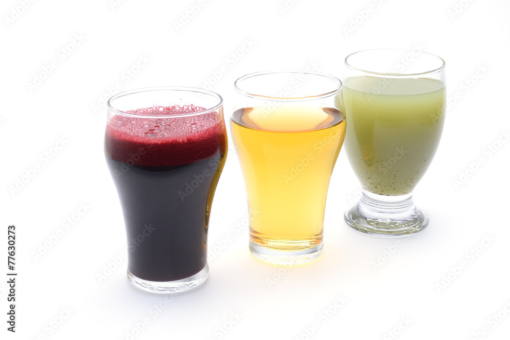 Fresh fruit and vegetable juices on white background