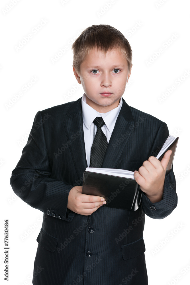 Young boy with a notebook Young boy with a notebook