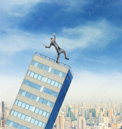 Businesswoman on the falling builging photo