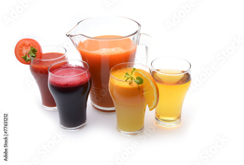 Fresh fruit and vegetable juices on white background