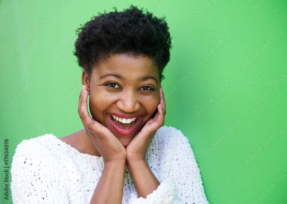 Smiling young woman with hands on face Smiling young woman with hands on face