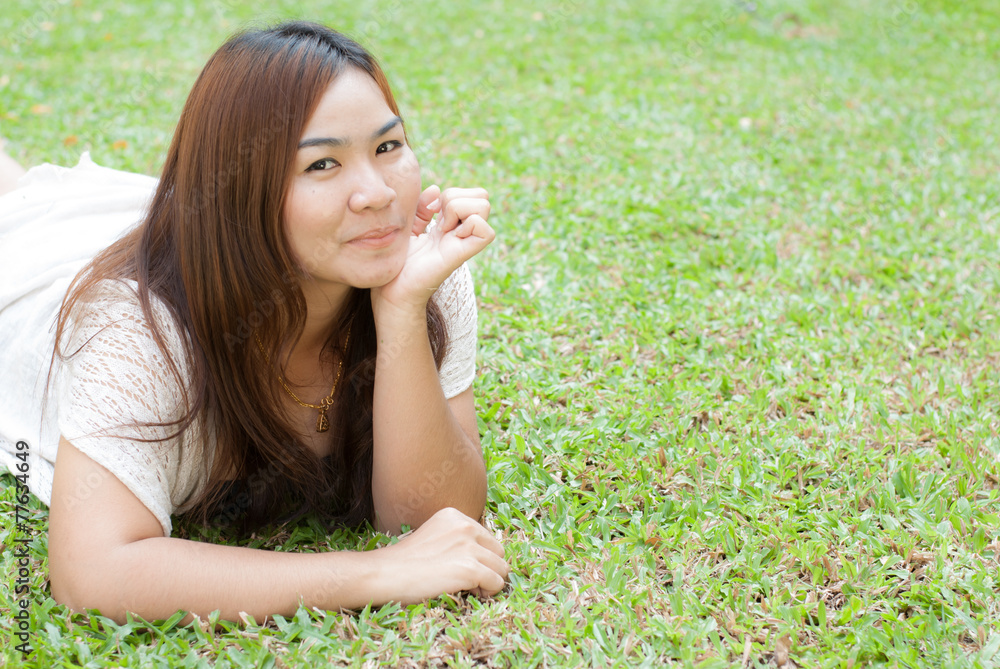 nice female lying down in the meadow of flowers, pretty girl rel nice female lying down in the meadow of flowers, pretty girl rel