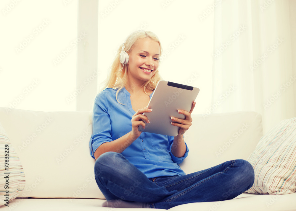 woman with tablet pc and headphones at home woman with tablet pc and headphones at home