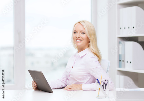 smiling businesswoman or student with tablet pc © Syda Productions