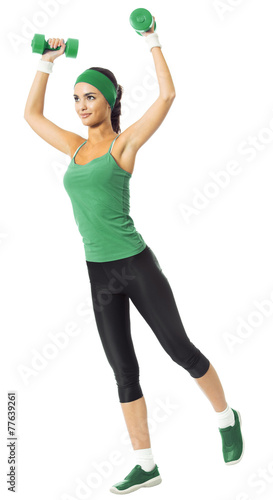 Cheerful woman exercising with dumbbells, isolated