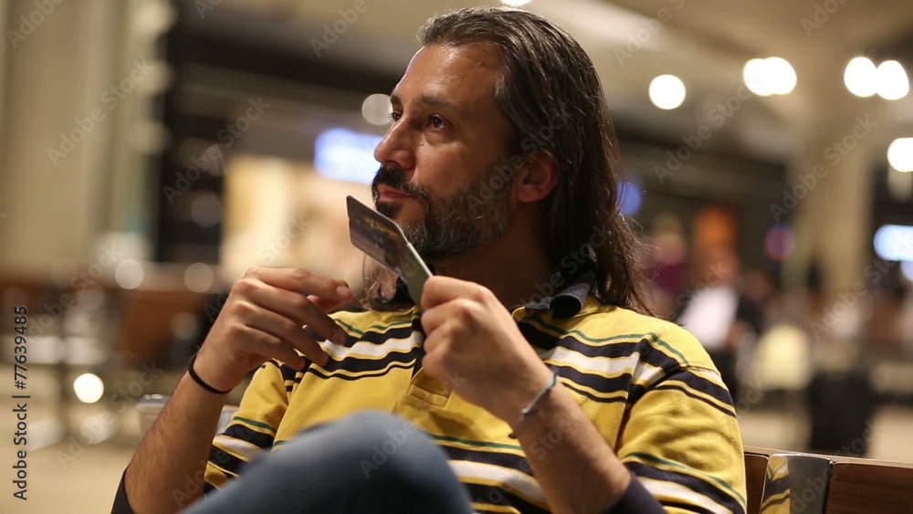 middle age bored brunette man waiting in airport middle age bored brunette man waiting in airport