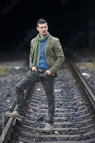 Man Posing On Train Tracks