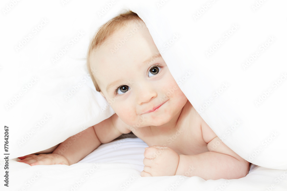 A Baby boy playing on the parent bed A Baby boy playing on the parent bed