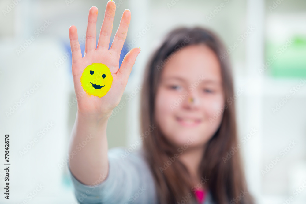 Painted colored hand, smile on hand Painted colored hand, smile on hand