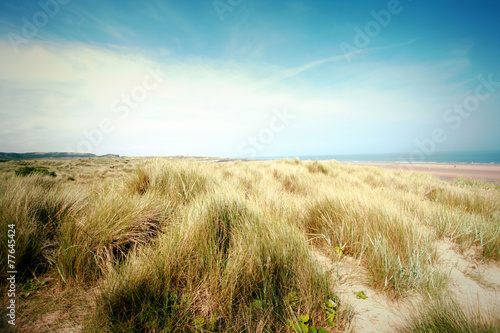 Beautiful beach with sand dunes and blue sky in UK