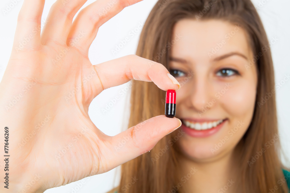 cute girl show capsule tablet and smiling cute girl show capsule tablet and smiling