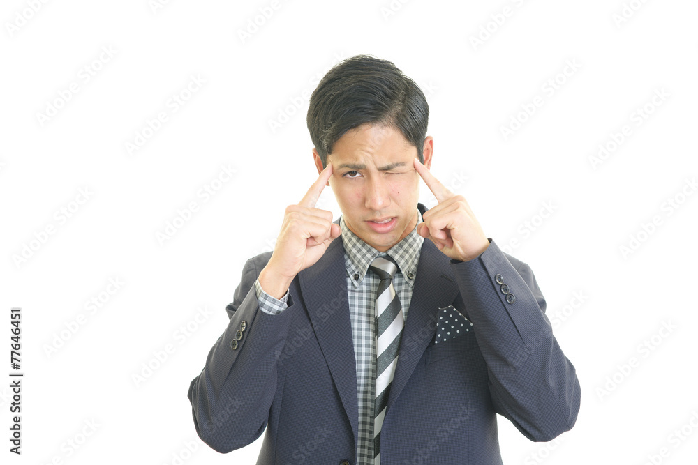 頭痛を訴えるビジネスマン