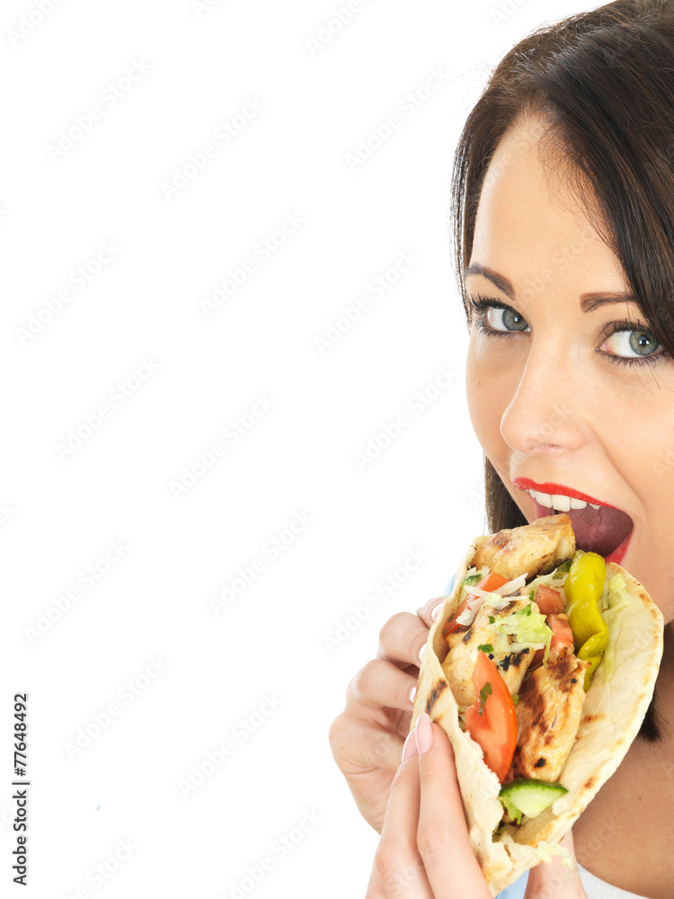 Young Woman Eating Chicken Kebab with Salad Young Woman Eating Chicken Kebab with Salad